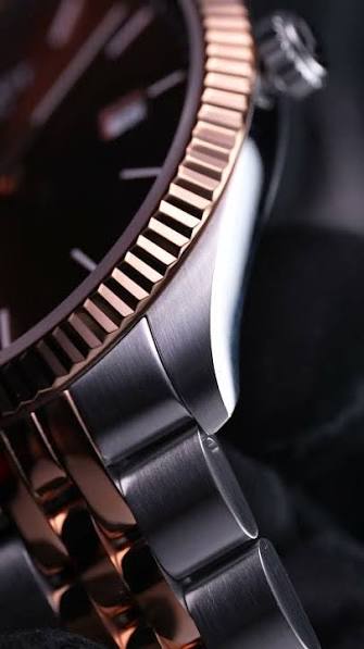 Tissot Ballade T156.410.22.291.01 40 mm con quadrante marrone guilloché a raggi di sole, cassa PVD oro rosa e bracciale in acciaio.