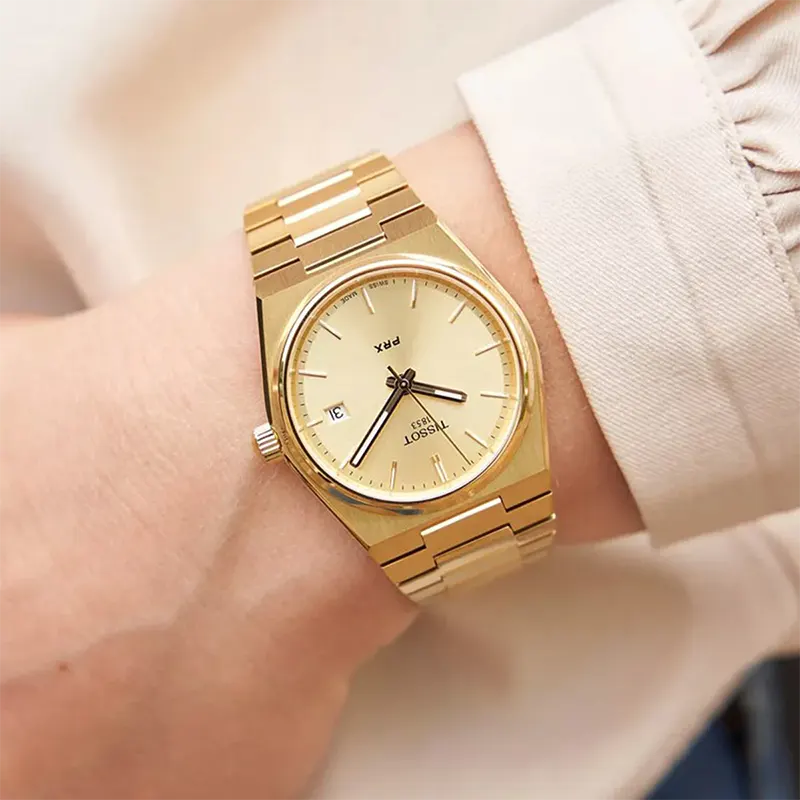 Tissot PRX 35mm quarzo Swiss Made oro quadrante champagne T137.210.33.021.00 bracciale acciaio PVD oro